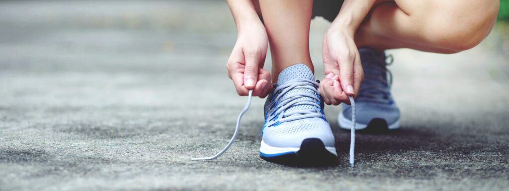 lacing up running shoes running - budget-friendly and popular hobby