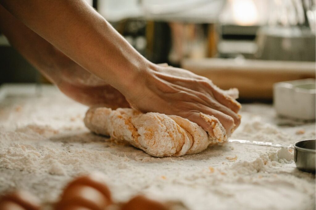 baking hands kneading bread dough - one of cheap hobbies you can do at home