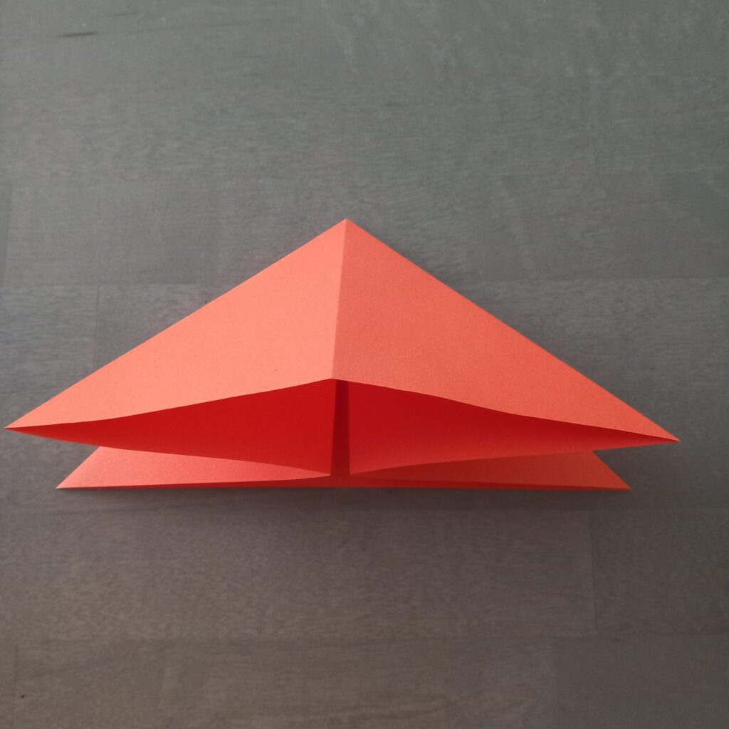 DIY Halloween lantern step 3 Step 3: Turning paper over and collapsing folds into flat triangle base for DIY origami string lights