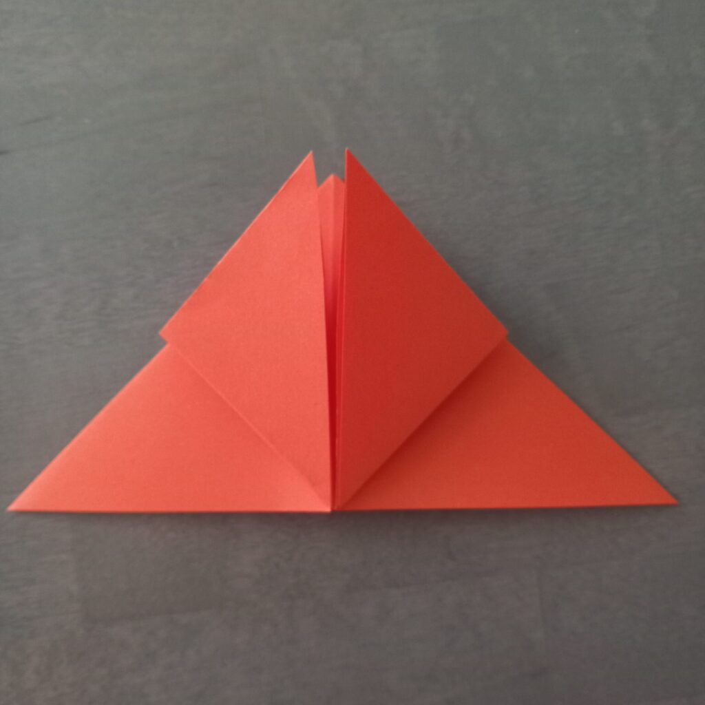 DIY Halloween lantern step 4 Step 4: Folding left and right corners up to center line for origami lantern.