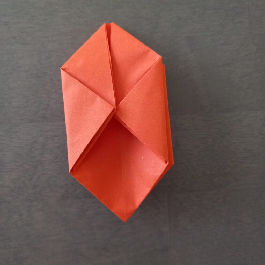 lantern origami step 14 Step 11: Repeating folds on left corner and back side for origami lantern.