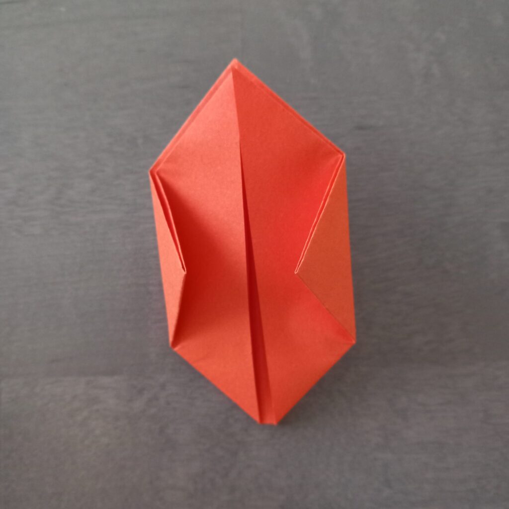 origami lantern step 8 Step 7: Folding bottom right corner up to middle crease for origami lantern